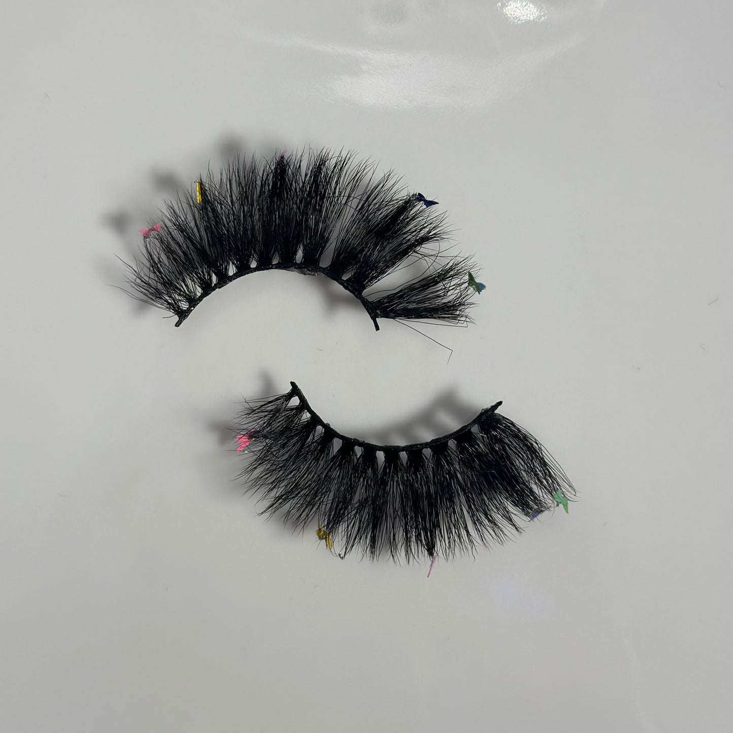 Top vew of Rainbow butterfly lashes in style Iconic from Fresa Cosmetics outside of the packaging