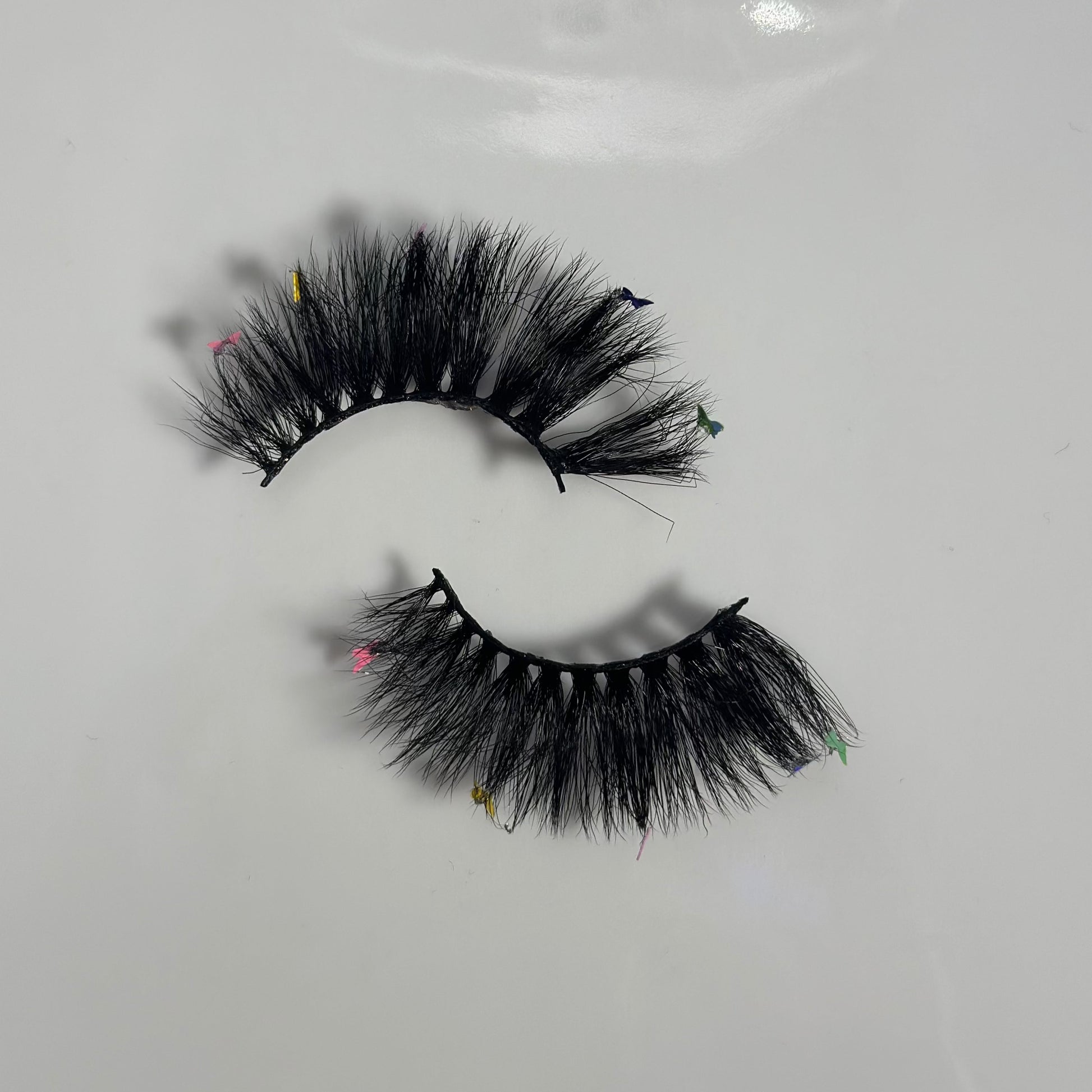 Top vew of Rainbow butterfly lashes in style Iconic from Fresa Cosmetics outside of the packaging